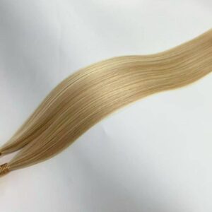 Top view of 100 remy human hair u tip fusion hair extensions showing premium quality for professional salon use.