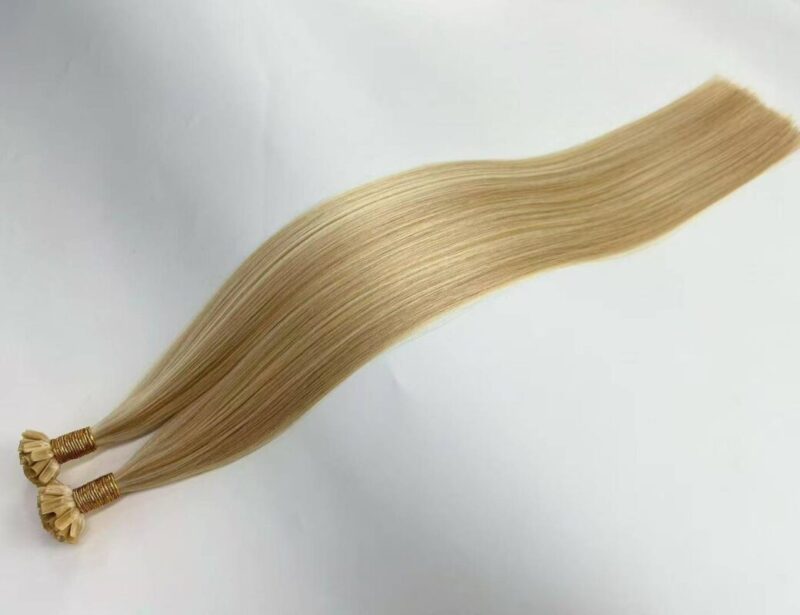 Top view of 100 remy human hair u tip fusion hair extensions showing premium quality for professional salon use.