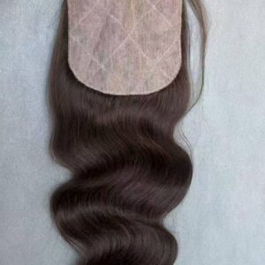Close-up of a 100% real human hair lace frontal piece showing precise hand-tied knots for an undetectable hairline