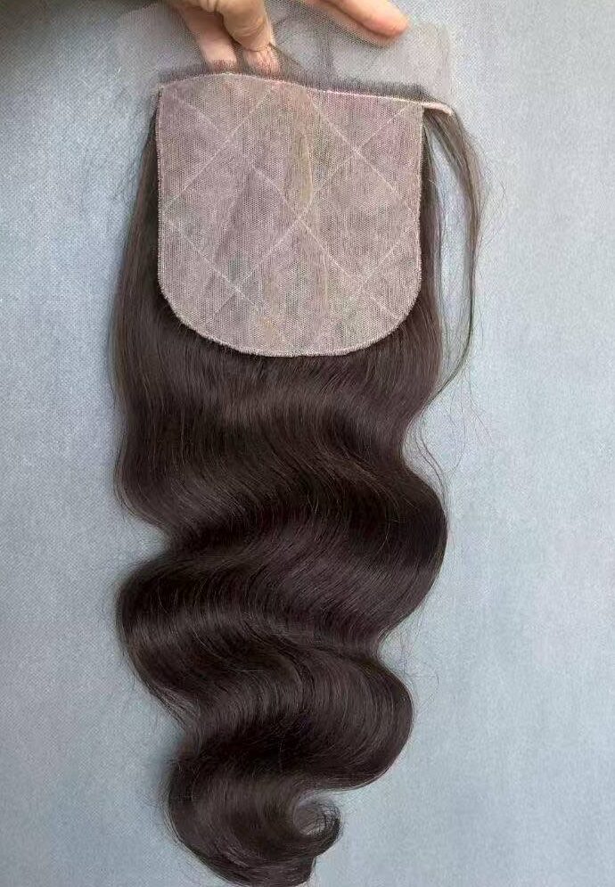 Close-up of a 100% real human hair lace frontal piece showing precise hand-tied knots for an undetectable hairline