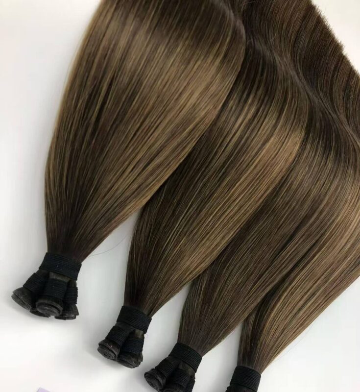 Cuticle-aligned flat tip human hair extensions showing the strong Italian keratin glue base for seamless salon installation