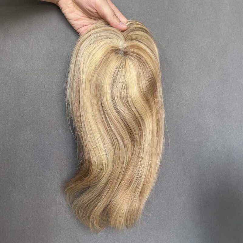 Breathable open weave hair topper in warm blonde highlight, designed for seamless blending with fine hair
