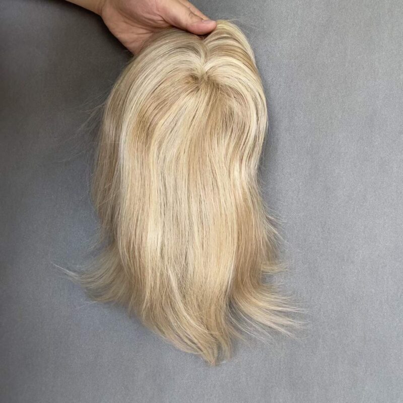 Premium mono top human hair topper in ash blonde blend, offering a realistic scalp parting for women