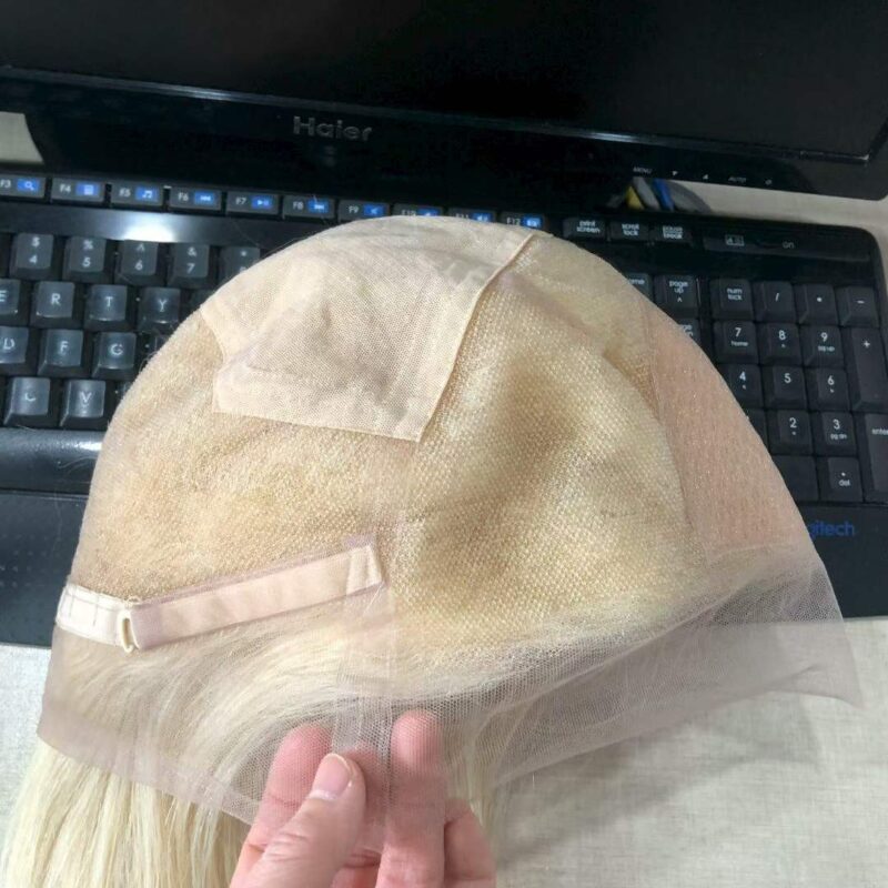 Inside cap and adjustable strap view of a 28 inch lace front wig human hair